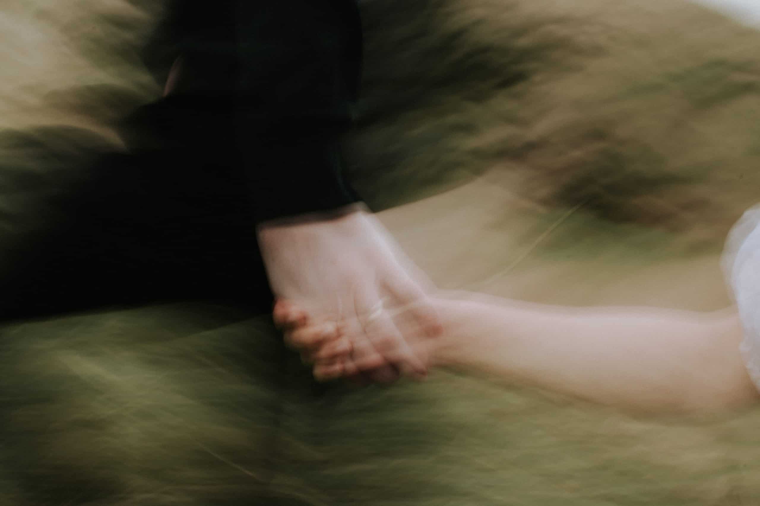 engagement shoot rings holding hands